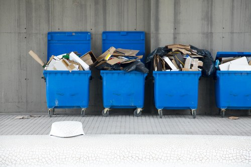 Crew sorting items during an Earls Court house clearance on a London street
